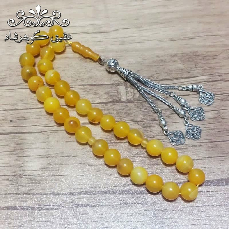 تسبیح عقیق زرد اصل درشت با شرابه فلزی